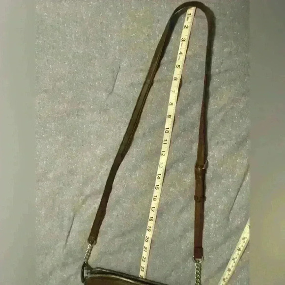 Nine West Crossbody brown with silver hardware. Snap closure and zipper pockets. - Picture 7 of 11